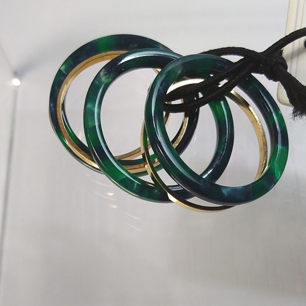Rand Brothers resin and brass stack rings. Size M(8). NWT